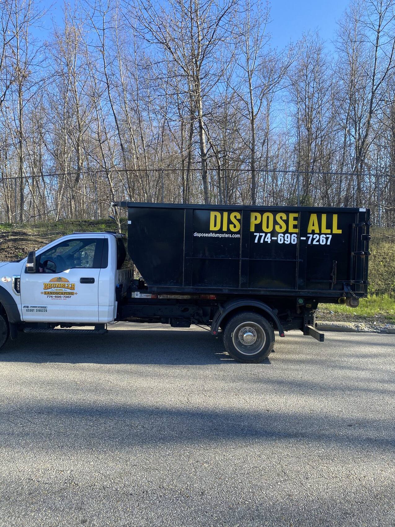 Dispose All roll-off dumpster on delivery truck in Central Massachusetts